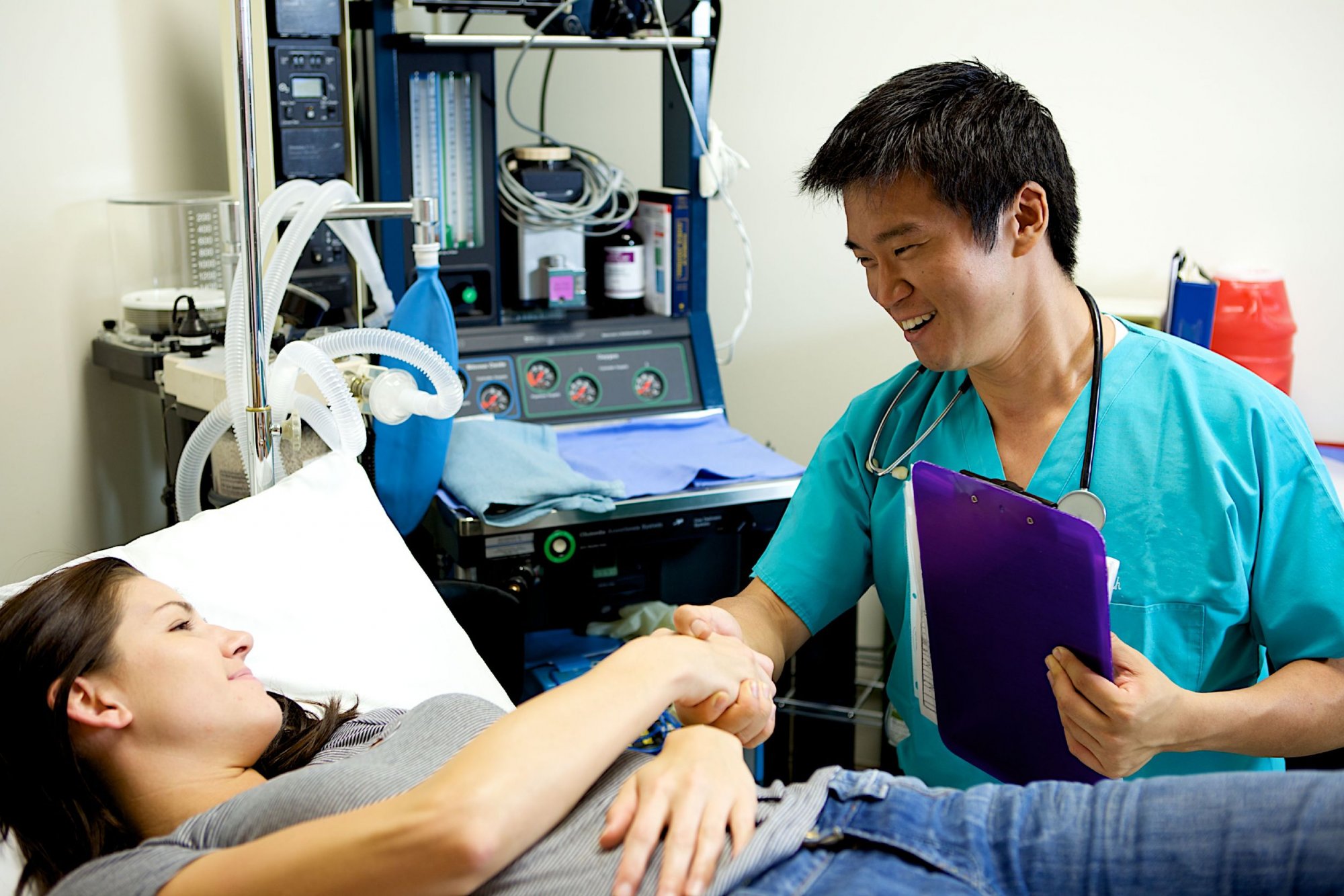 Asian-doctor-with-female-patient